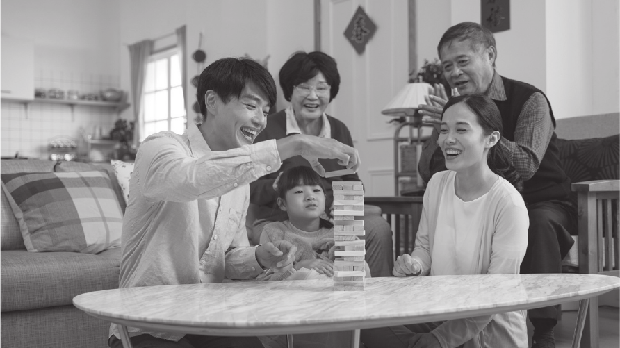 Family playing a table game together